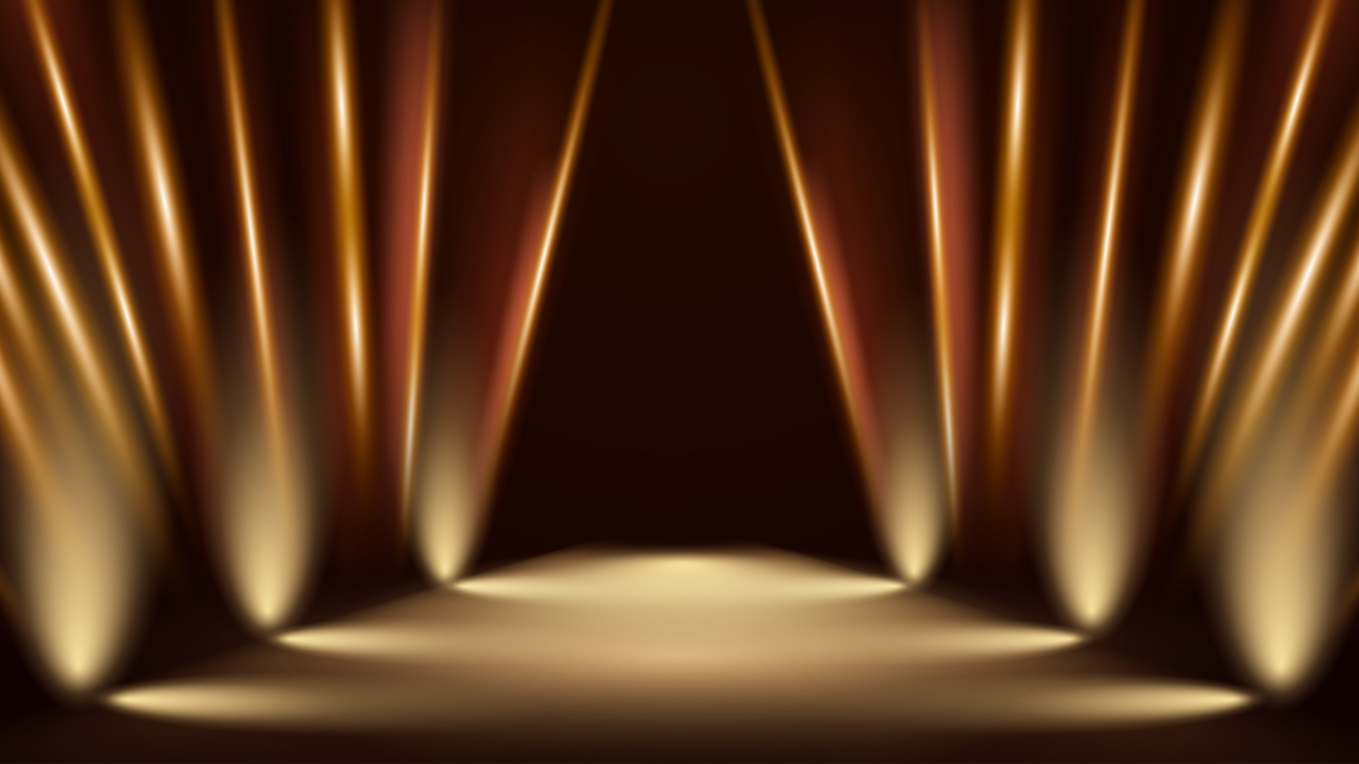 Golden spotlights illuminating the Mela Hall of Fame stage
